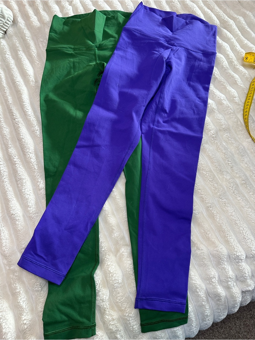 Two pairs of TNA action leggings